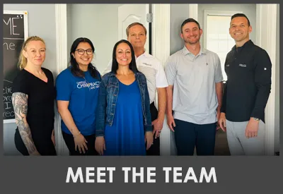 Jeff Getbehead smiling with his team.